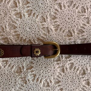 Brown leather belt with gold buckle and floral accents